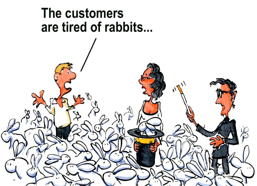 Creative Director pulling Rabbits out of his black hat