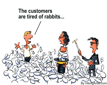 Creative Director pulling Rabbits out of his black hat