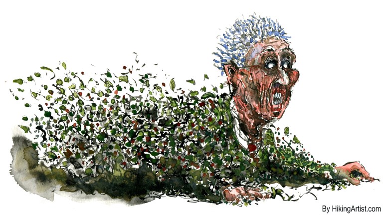 man being blown by leafs, trying to hold on