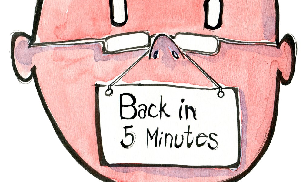 man with a sign, saying he is taking a five minutes break