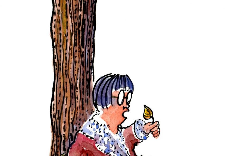 woman sitting in the leaves talking with them