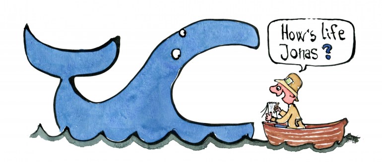 Journalist standing in a little boat, asking questions to Jonas inside the whale