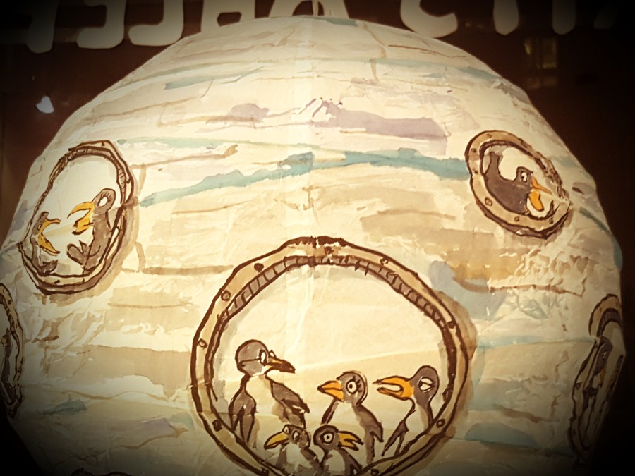 Drawing of a group of penguins inside a sphere ice submarine, painted on rice paper lamp. art by Frits Ahlefeldt