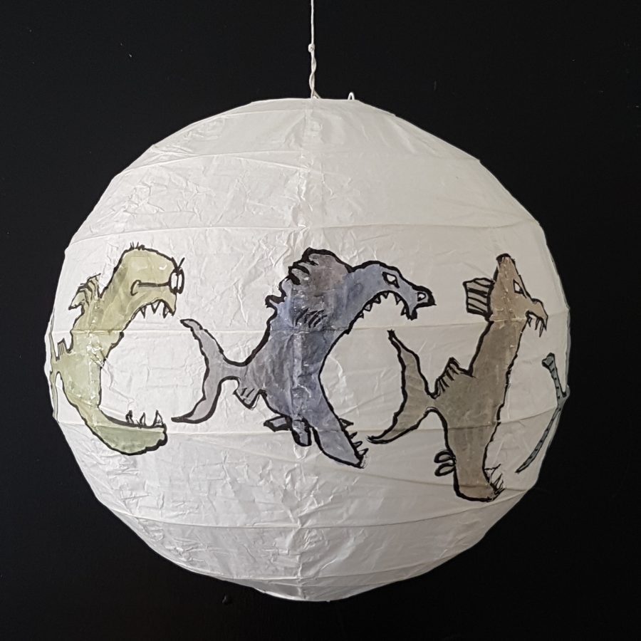 Drawing of fish eats fish eats fish on rice paper lamp. Artwork by Frits Ahlefeldt